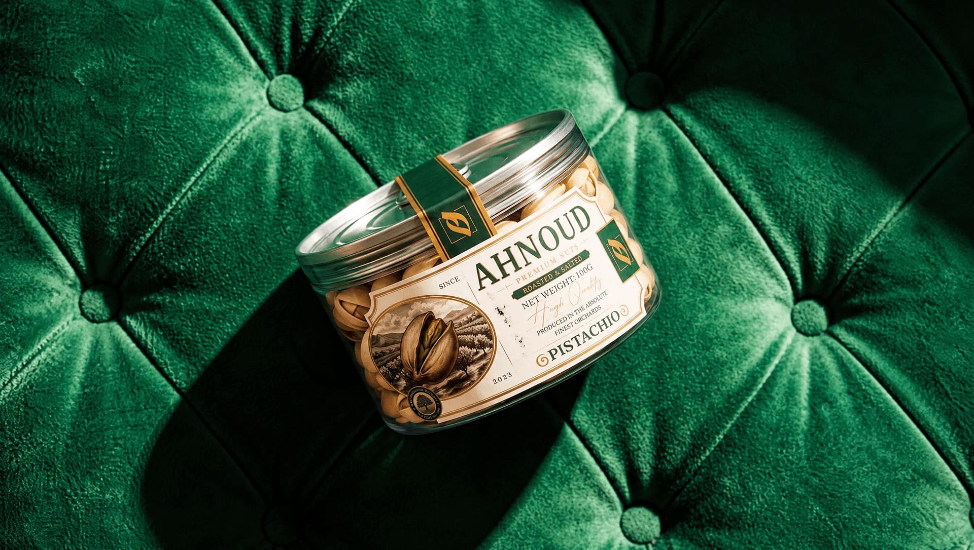 An Ahnoud pistachio can resting on green tufted velvet